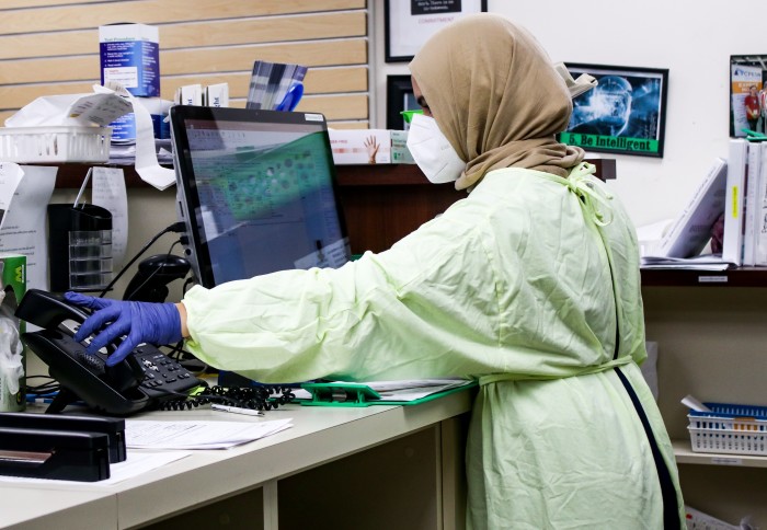 A woman working in personal protective equipment