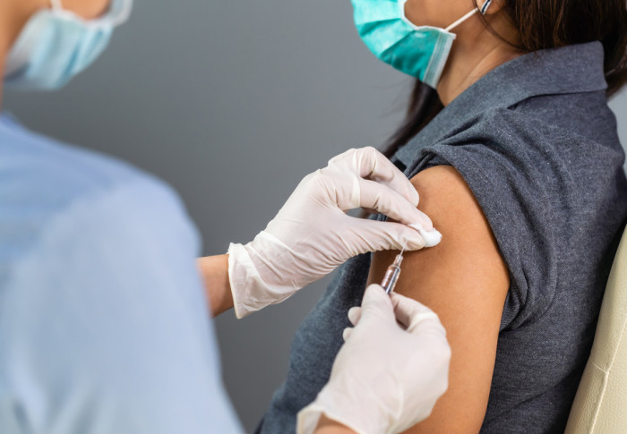 Woman receiving a vaccination