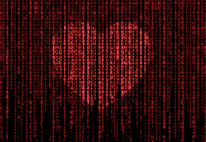 Red heart graphic with lines of computer code