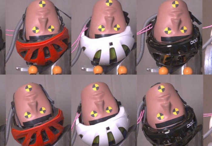 Photo of crash test dummy heads in helmets upside down