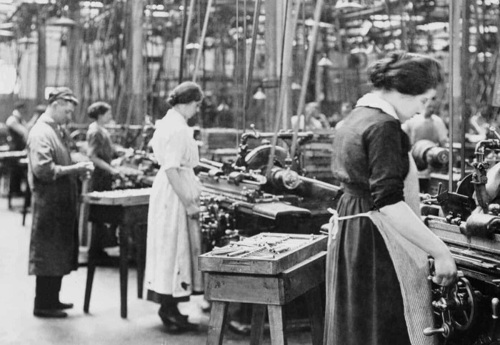 Black and white image of women working in a factory