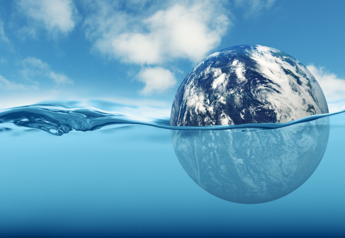 Digital image of the Earth partly submerged in water