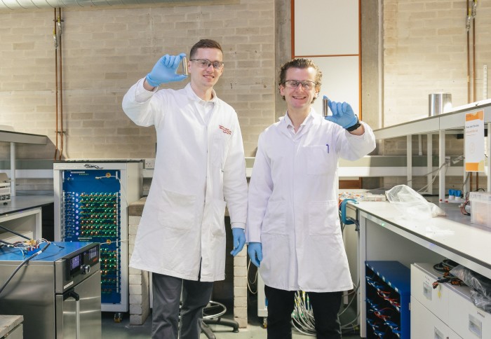 Dr Gavin White and Dr Kieran O'Regan, co-founders of About:Energy, pose with Lithium-ion battery cells in a laboratory