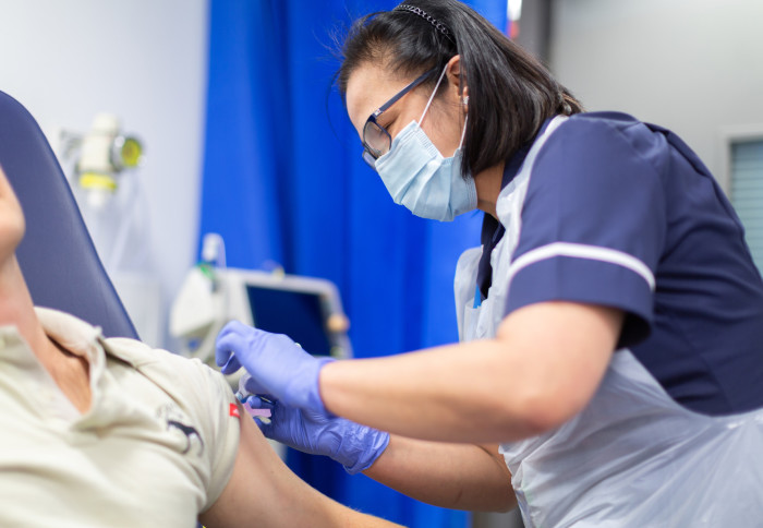 Nurse vaccinating a member of the public at the CRF