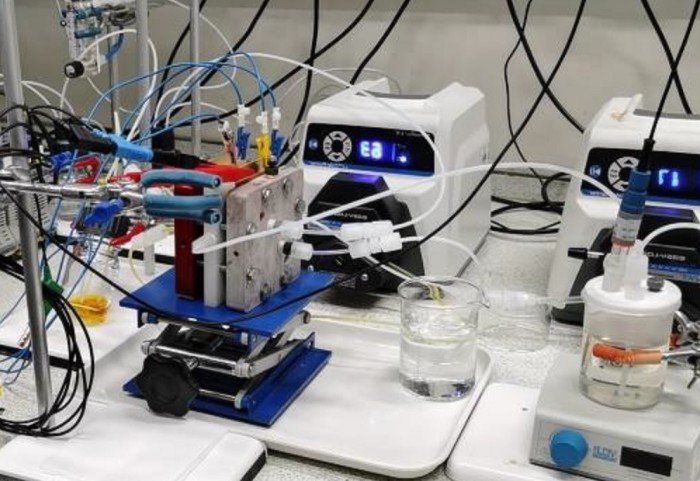 The experimental setup, showing a device of several layers connected to many cables