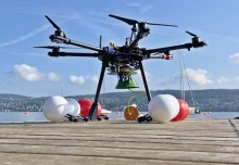 Shape-shifting drone flies and dives to seek aquatic environmental clues 