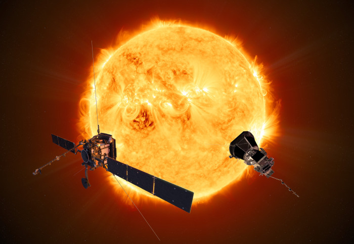 Illustration of two spacecraft in front of the sun