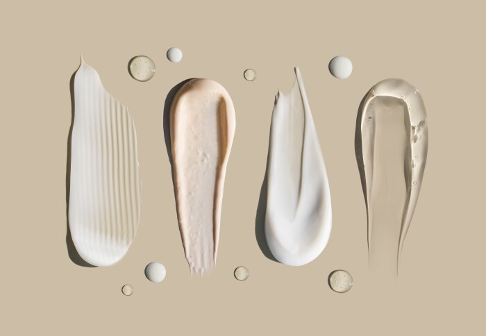 Smears of cosmetic on a beige background