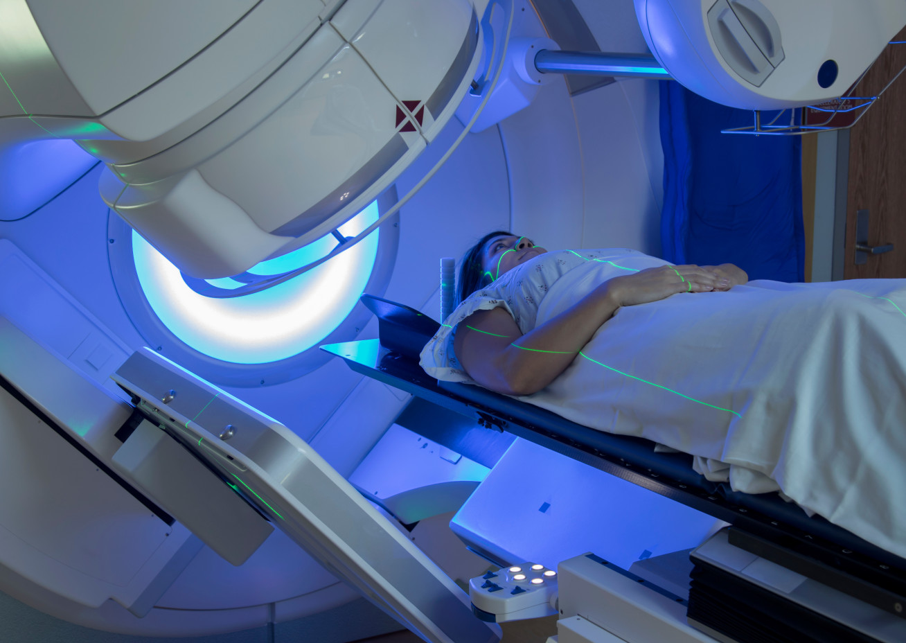 Image of a woman receiving radiation therapy treatments for breast cancer
