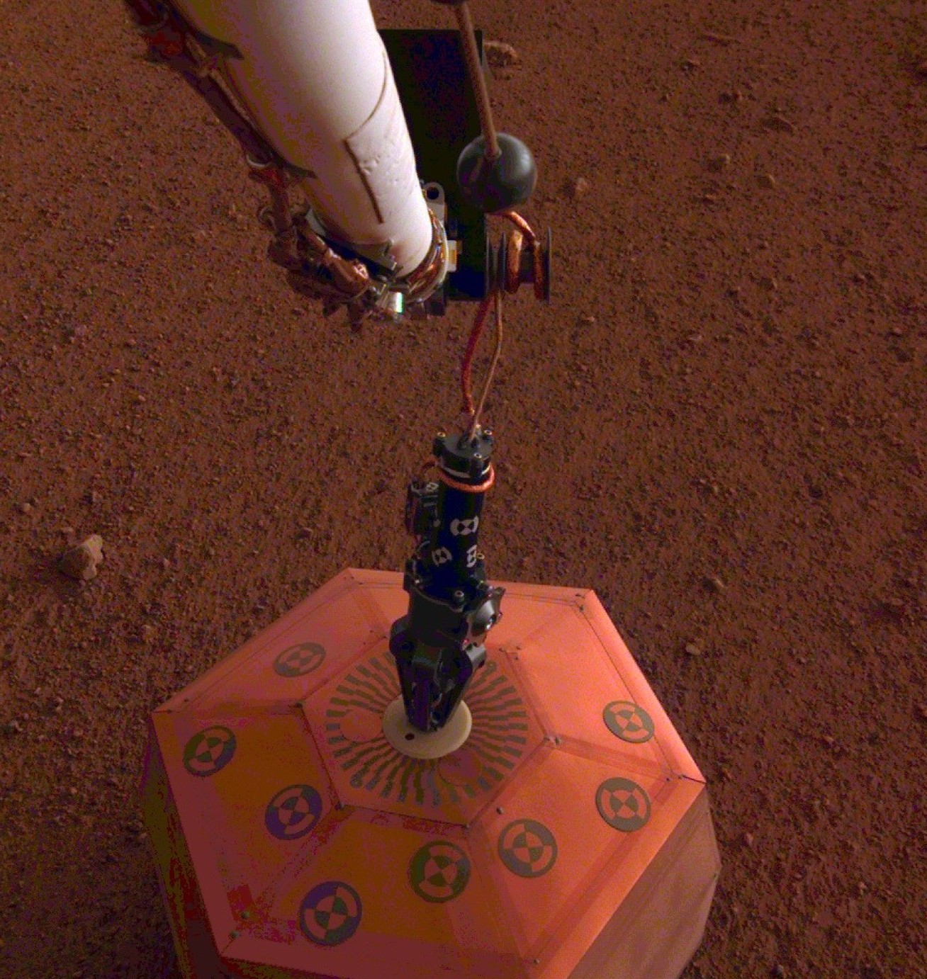 Robotic arm placing an instrument on the surface