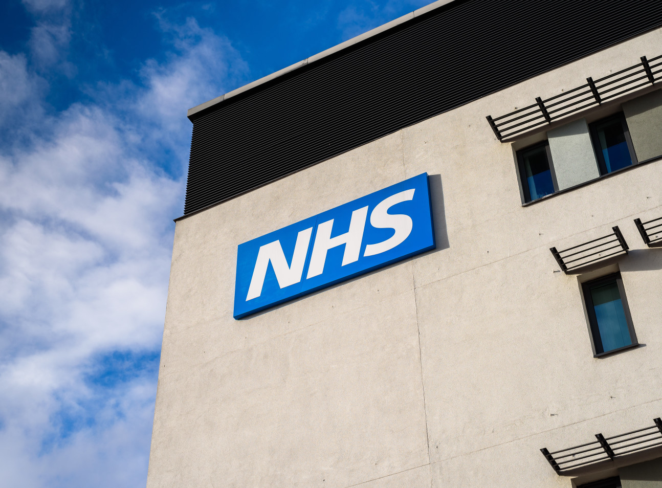 NHS logo on a hospital building