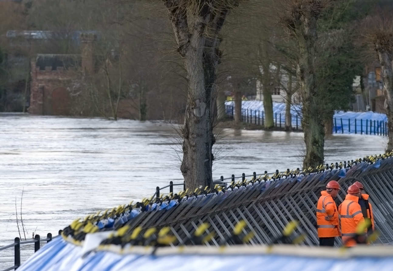 An image of temporary flood defences along a river