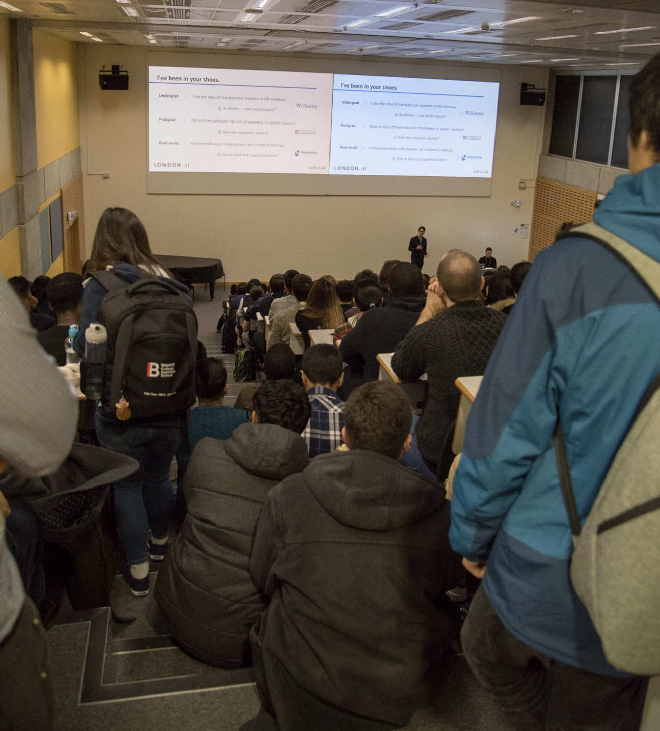 Some excited attendees sat on the stairs to listen to the speakers!