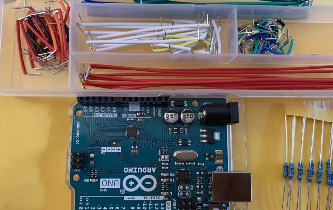 An image of the Arduino device and coated metal wires