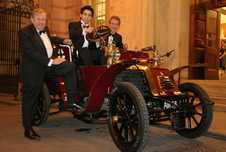Warwick Faville (CGCA), in the drivers seat of Bo, Imperial's vintage car, is James Fok (President CGCU) and Lord Browne of Madingley