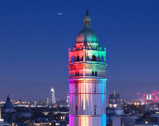 Photo of the Queen's Tower illuminated for LGBT History Month