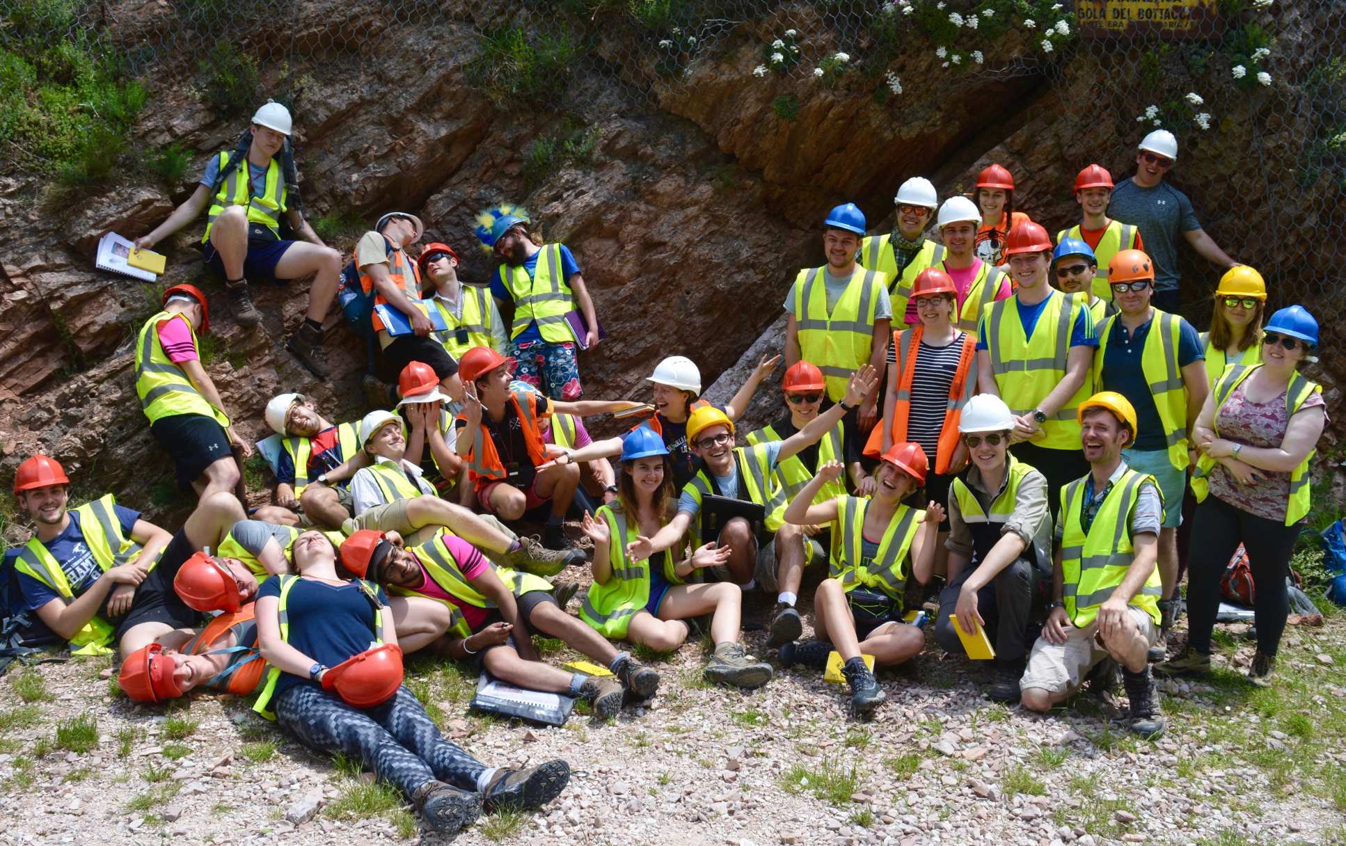 Fourth year students in the Appenines pose for a group photo in their fluorescent vests and hard hats.