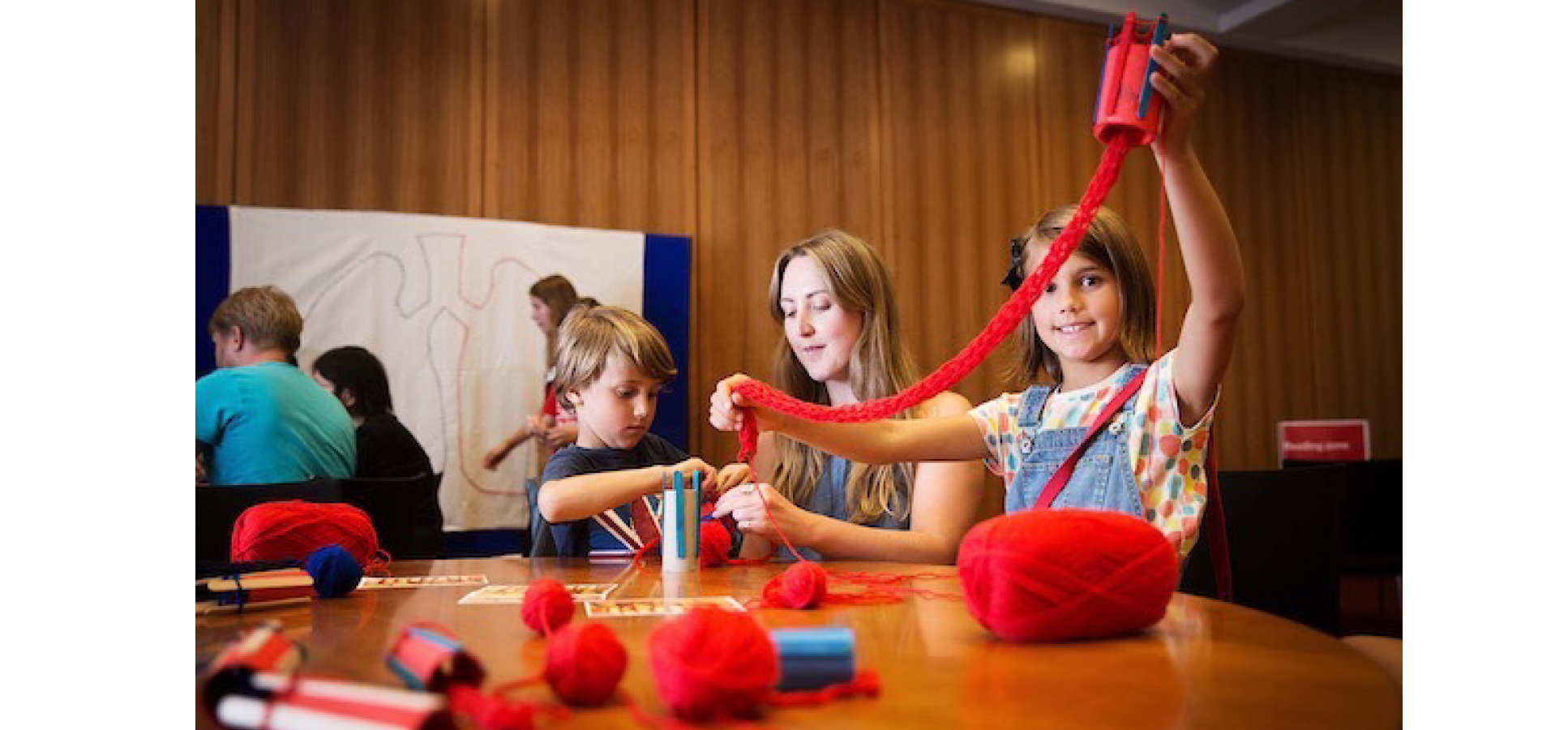 Kids knit at table