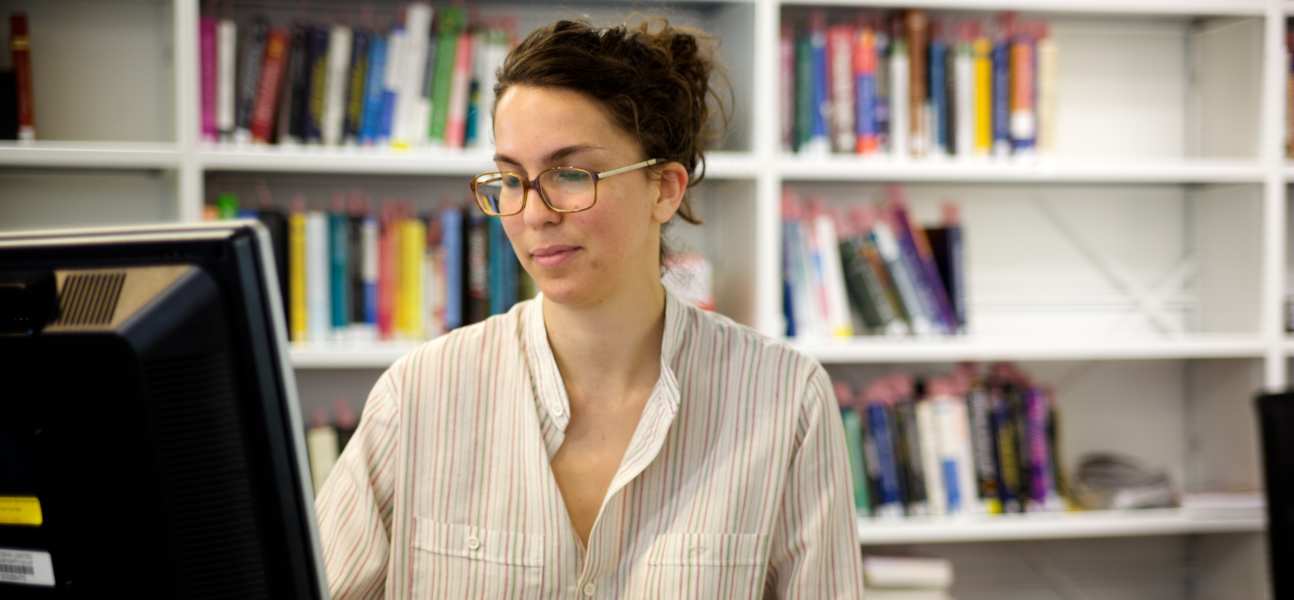 Student researching at a computer