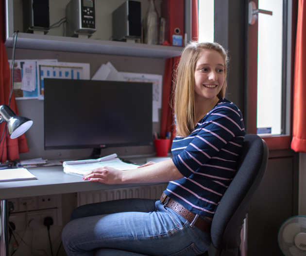 Student working at her desk