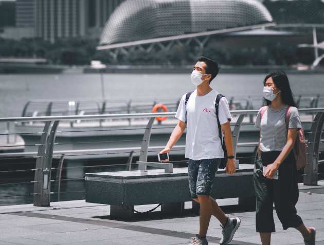 Two people wearing face masks