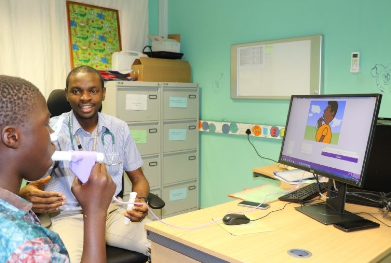 Dr Nkereuwem with patient