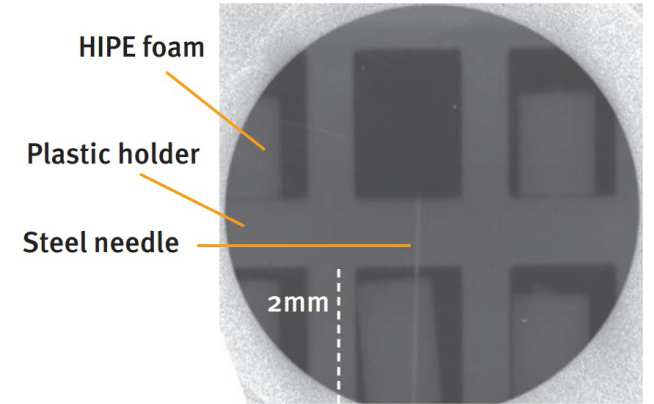 Figure 4: Radiograph of 6 foams using a 12um Ti transmission window (3-5 and above 6KeV). 300um, stainless steel needle used to provide a fiducial behind the centre foam, lower row.