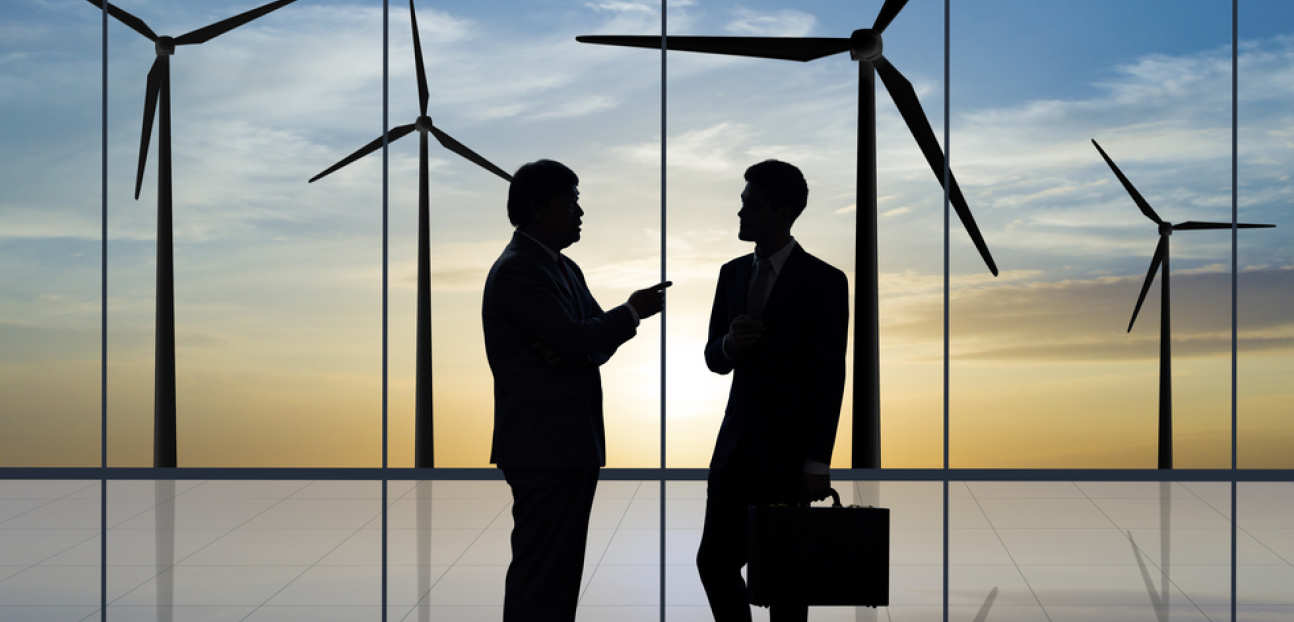 Meeting in front of wind turbines