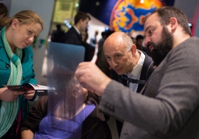 Vistors examine a DNA blot at the Imperial Fringe event