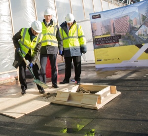 Professor David Gann lays the final cement in the constuction of the Translation and Innovation Hub