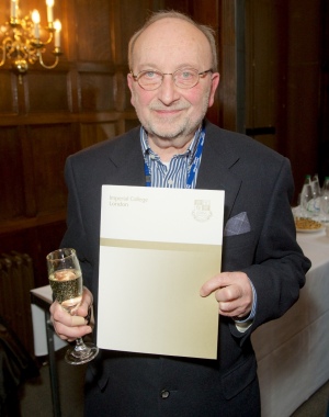 man holding certificate 