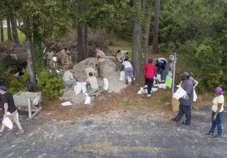 People filling sandbags 