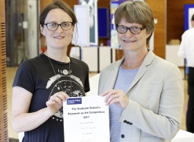 Amy being presented with her prize by Professor Sue Gibson