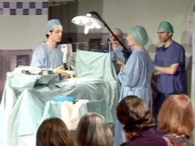 A theatrical production takes place with people dressed in medical outfits