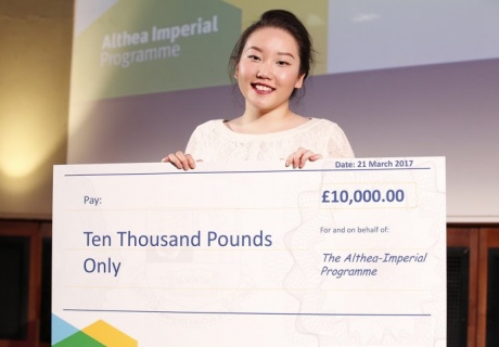 Medical student Olivia Ahn holding her cheque for £10,000