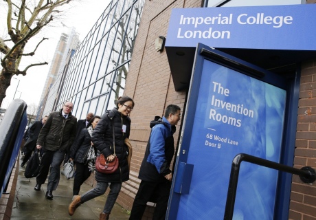 Diplomats enter the invention rooms throuhg a branded front door