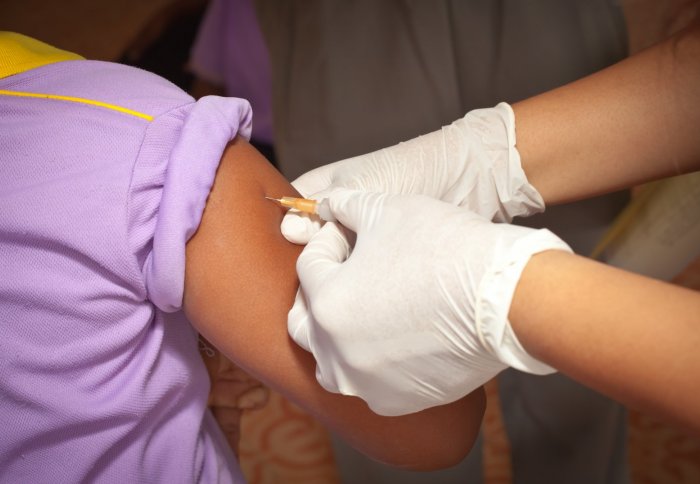 Schoolgirl getting vaccination