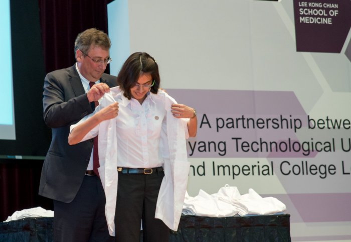 Professor Dermot Kelleher presents new student Lavisha Punjabi with her White Coat