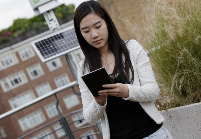 Student Xi Liu on a green roof