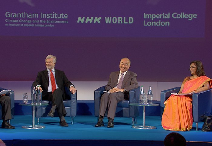 Panel members discuss climate change on the stage at Imperial's Great Hall