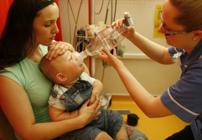 Nurse uses respirator on baby