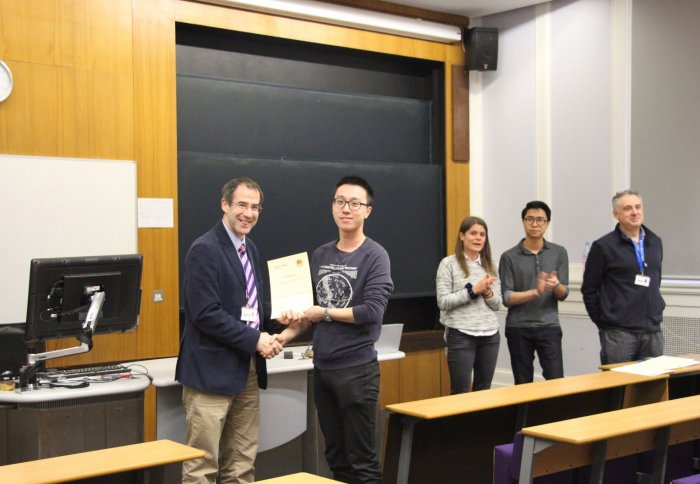 Professor Haynes presenting First Prize to Zebang Zheng for best scientific content