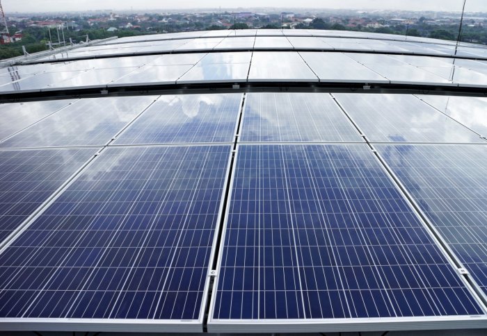 A curved roof covered in solar panels