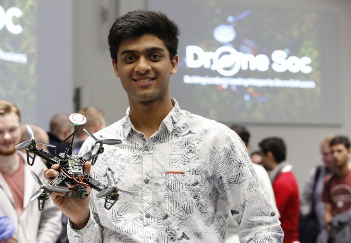 Student with a drone at the DroneSoc launch event