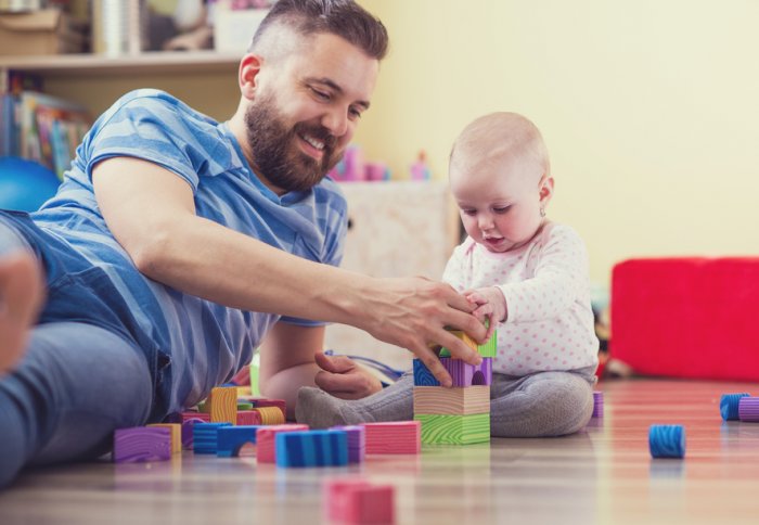 Father playing with baby