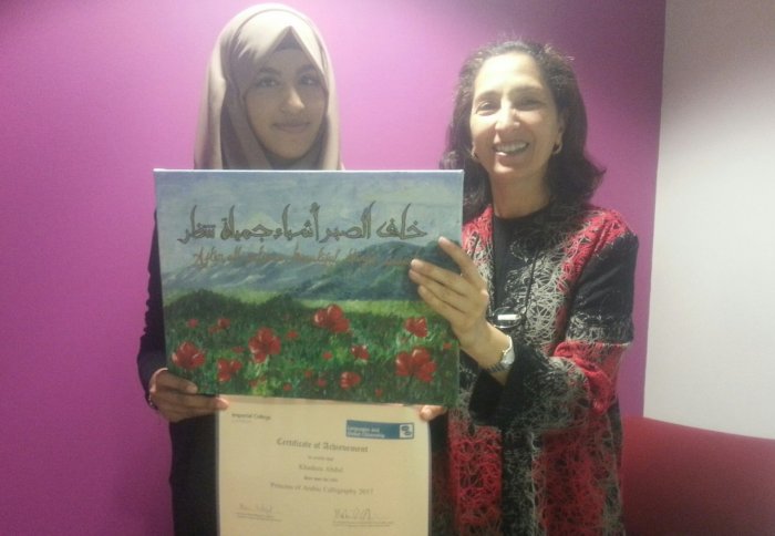 Khadeza receiving her certificate
