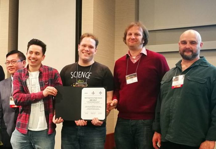 Daniel Liew, Cristian Cadar and collaborators pick up the Best Experience Paper award.
