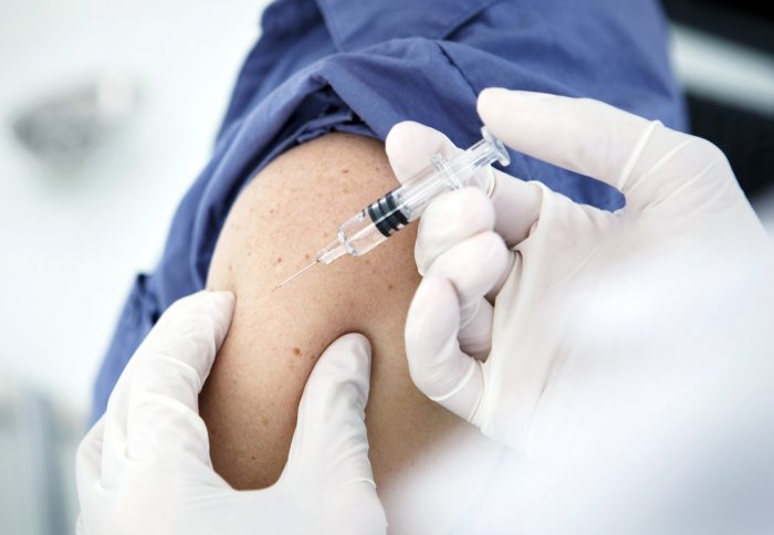 Arm injected with vaccine