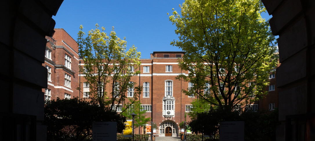 Beit Quad pictured through through a walkway arch on a sunny summer's day