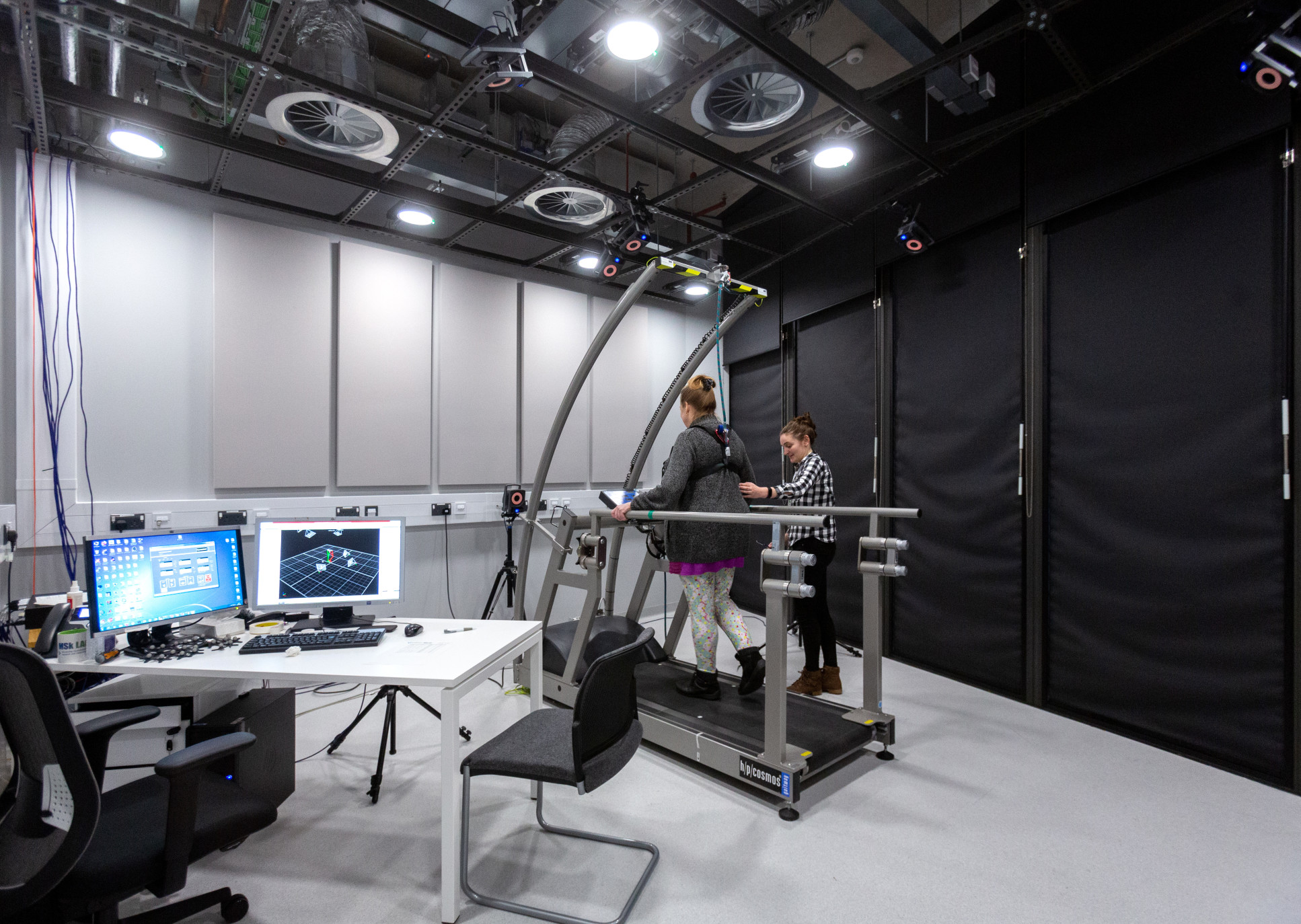 A woman on a treadmill having her gait analysed